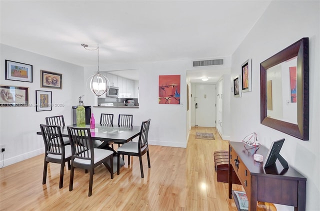 dining room featuring light wood-type flooring