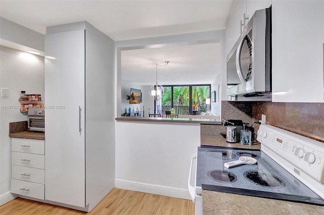 kitchen with tasteful backsplash, white cabinetry, light hardwood / wood-style flooring, and white range with electric cooktop