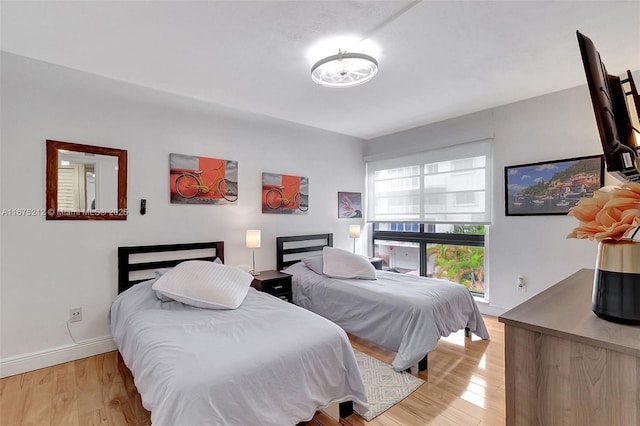 bedroom featuring light wood-type flooring