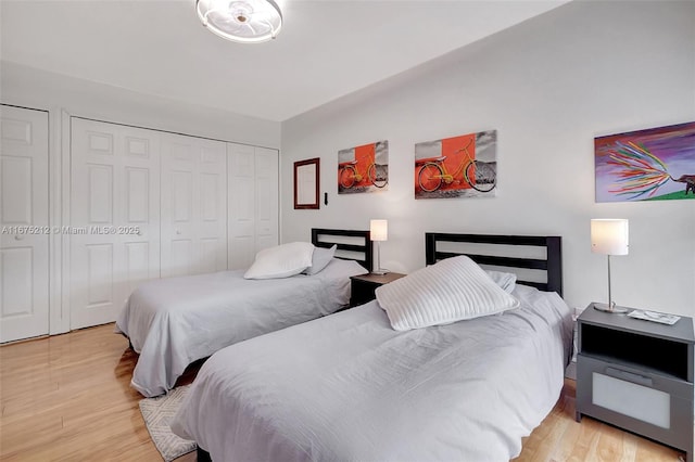 bedroom featuring a closet and light hardwood / wood-style flooring