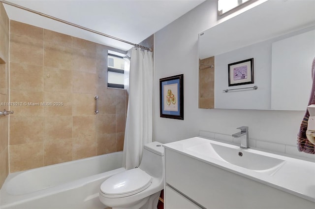 full bathroom with vanity, shower / bath combo, and toilet