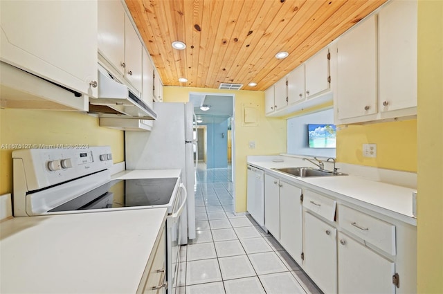 kitchen with sink, white cabinets, white appliances, light tile patterned flooring, and wood ceiling