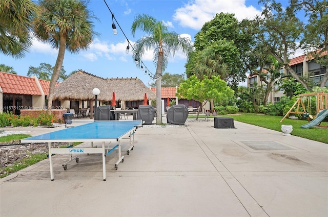 view of patio featuring a playground