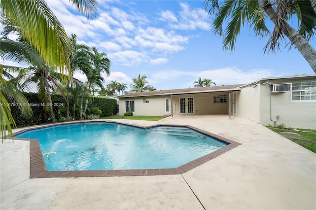 view of pool featuring a patio area and french doors