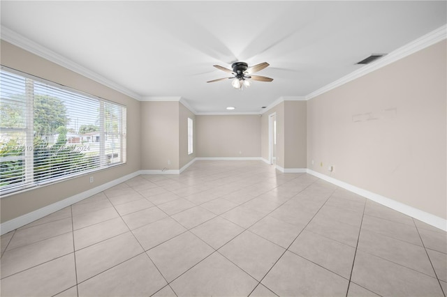 unfurnished room featuring ceiling fan, light tile patterned floors, and crown molding