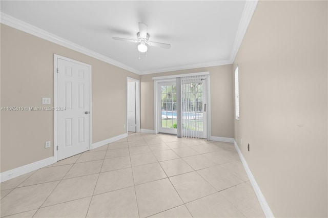 unfurnished room featuring light tile patterned floors, ceiling fan, and ornamental molding