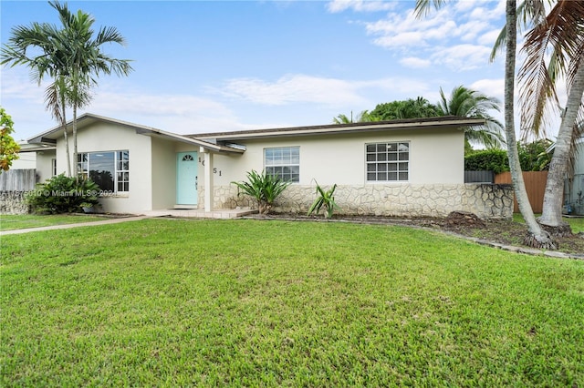 ranch-style house featuring a front lawn