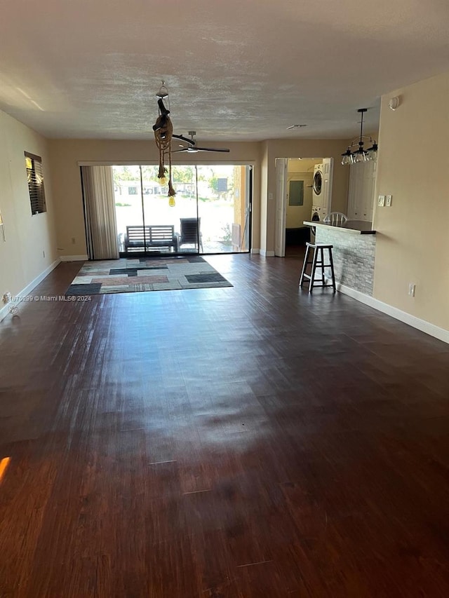 unfurnished living room featuring dark wood-type flooring