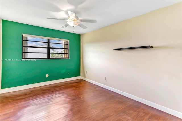 unfurnished room with wood-type flooring and ceiling fan