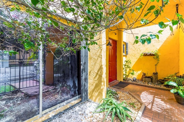 doorway to property featuring a patio area