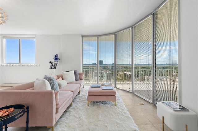 tiled living room with floor to ceiling windows