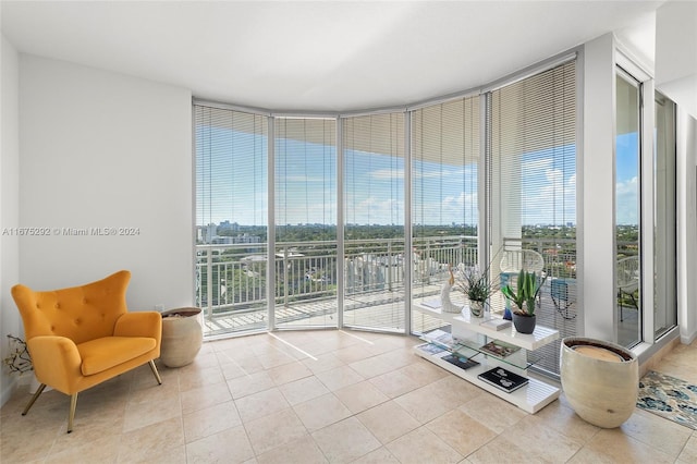 sitting room with floor to ceiling windows and a wealth of natural light