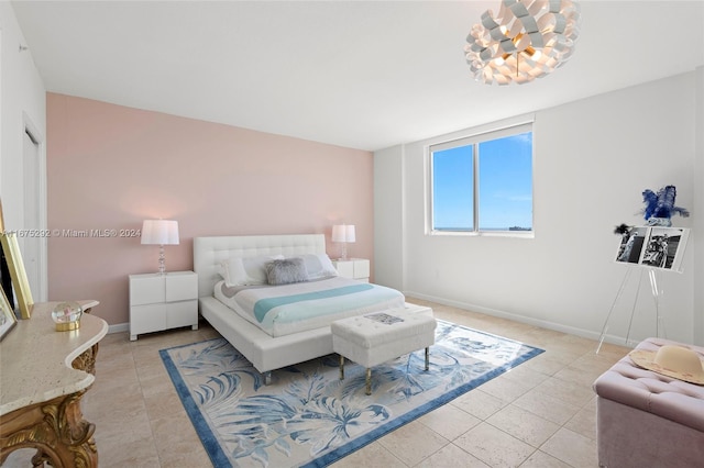 bedroom with light tile patterned floors