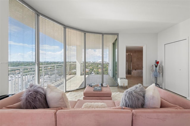 living room featuring a wall of windows