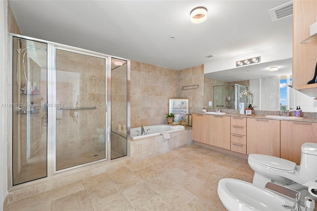 full bathroom with tile patterned flooring, toilet, plus walk in shower, a bidet, and vanity