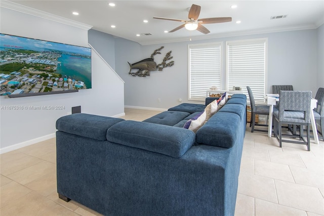 living room with ceiling fan, ornamental molding, and light tile patterned floors