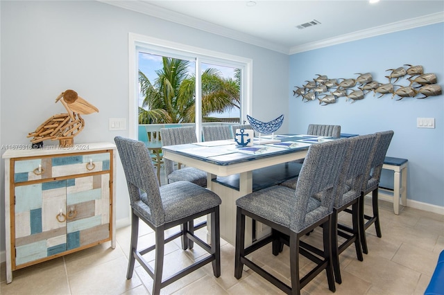 tiled dining space with crown molding