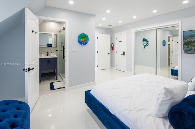 bedroom with a closet and ensuite bath