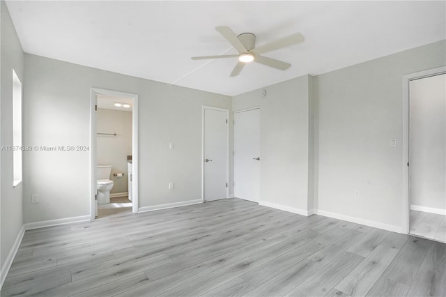 unfurnished bedroom with connected bathroom, ceiling fan, and light hardwood / wood-style flooring