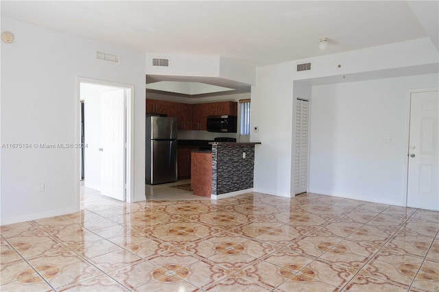 kitchen featuring appliances with stainless steel finishes and light tile patterned floors