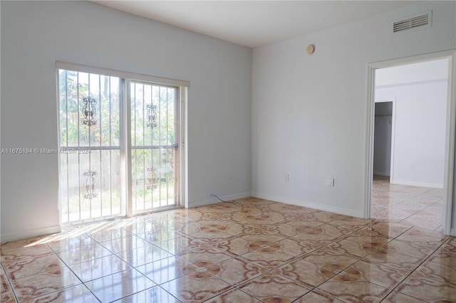 view of tiled spare room