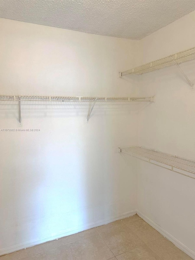4045 W Mcnab Rd Unit 106G, Pompano Beach, FL 33069 - spacious closet with light tile patterned floors