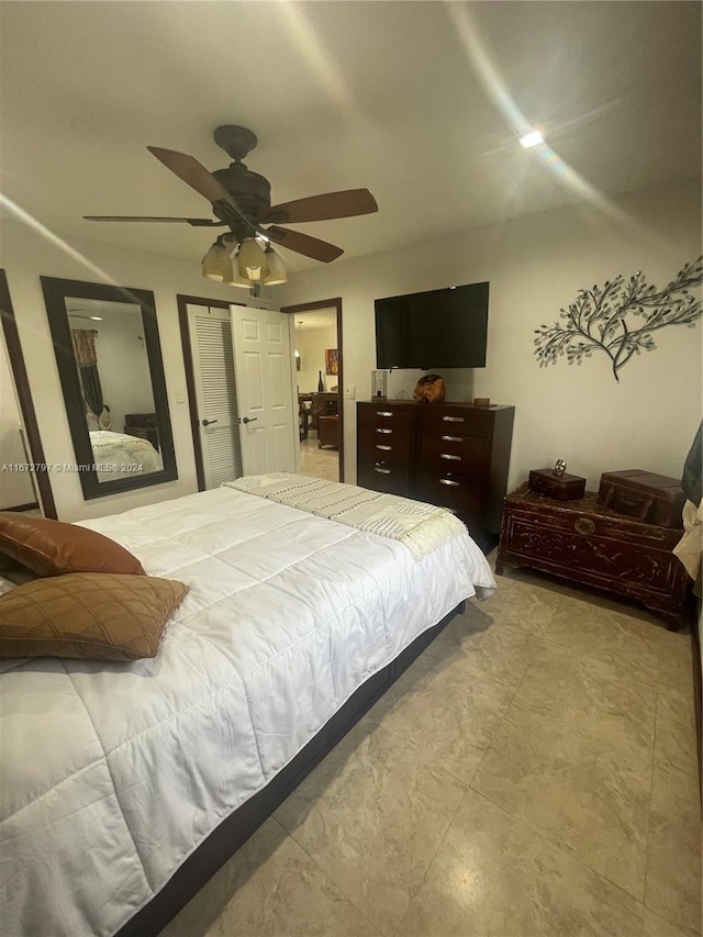 bedroom featuring ceiling fan and a closet