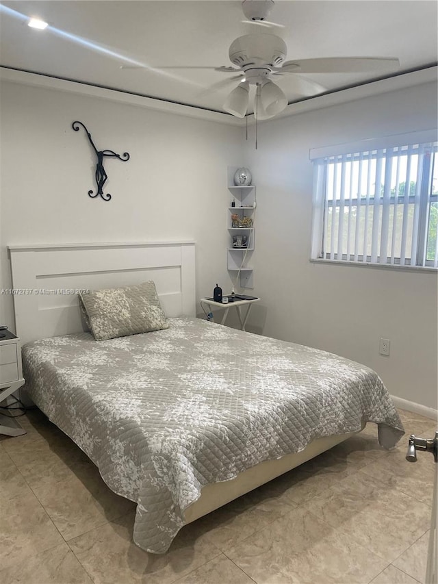 tiled bedroom with ceiling fan