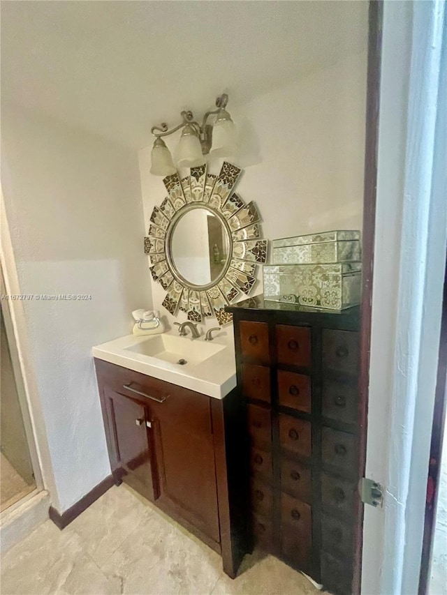 bathroom featuring a shower and vanity