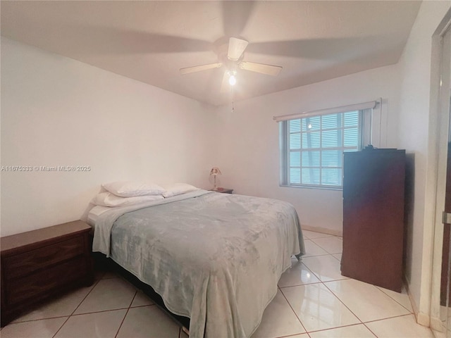 tiled bedroom with ceiling fan