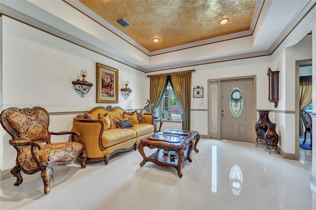 living room featuring crown molding and a tray ceiling