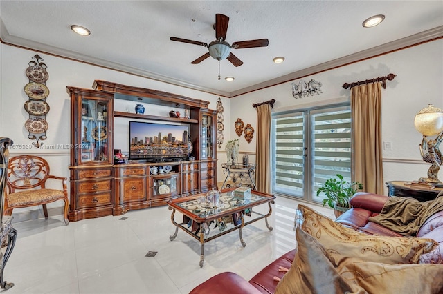 tiled living room featuring ceiling fan, a textured ceiling, and crown molding