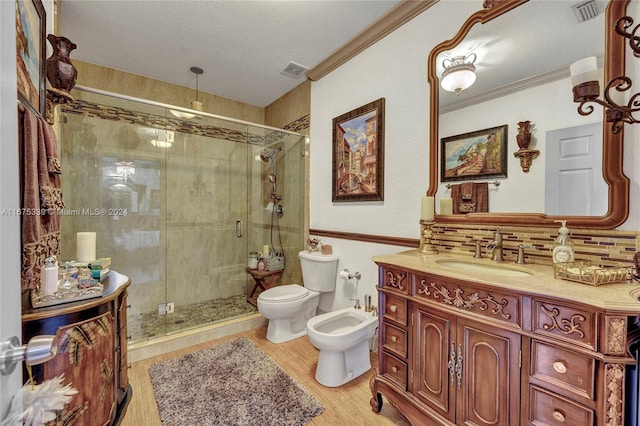 bathroom featuring decorative backsplash, toilet, an enclosed shower, a bidet, and vanity