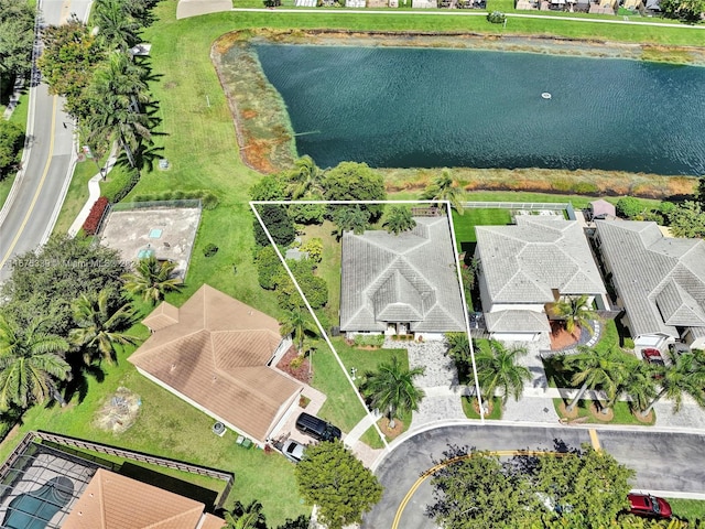 birds eye view of property with a water view