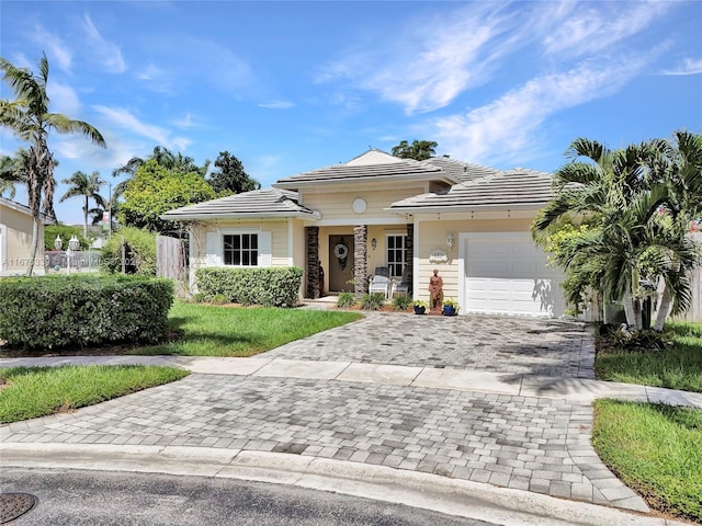 view of front of property with a garage