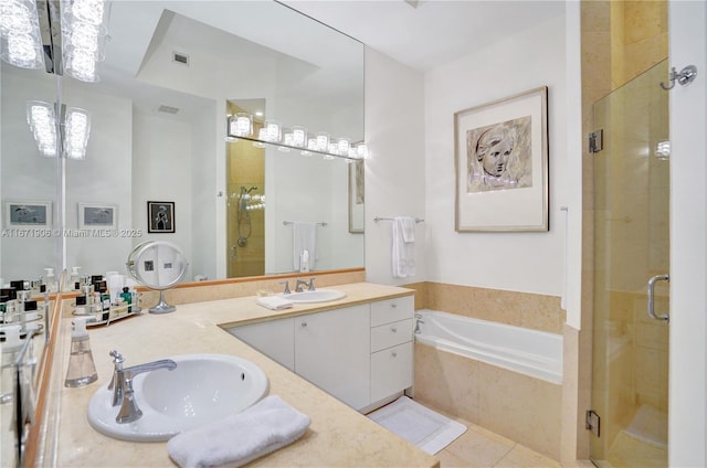 bathroom featuring tile patterned flooring, vanity, and independent shower and bath