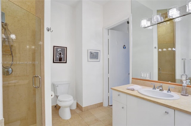 bathroom featuring tile patterned flooring, vanity, toilet, and walk in shower