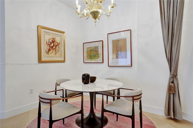 dining area featuring a notable chandelier