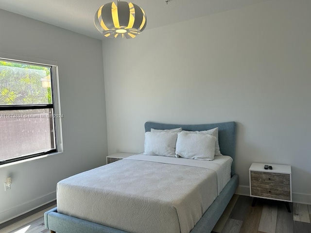 bedroom featuring wood-type flooring