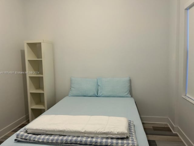 bedroom featuring hardwood / wood-style floors