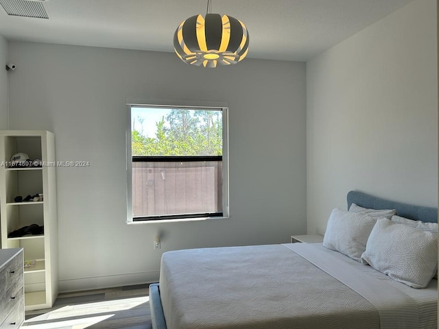 bedroom featuring light wood-type flooring