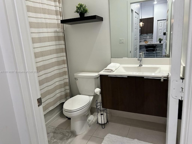 bathroom featuring tile patterned floors, toilet, vanity, and a shower with curtain