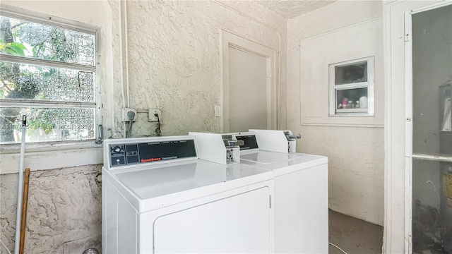 laundry area featuring washing machine and clothes dryer