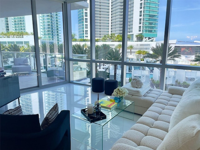 living room featuring tile patterned floors and floor to ceiling windows