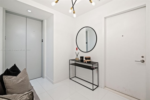 foyer entrance with light tile patterned floors