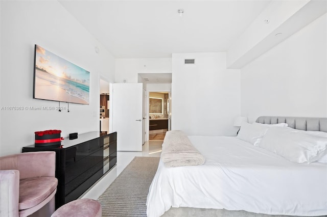 bedroom featuring radiator and ensuite bathroom