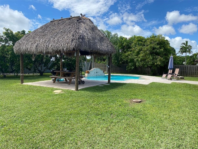 view of pool with a gazebo, a yard, and a patio