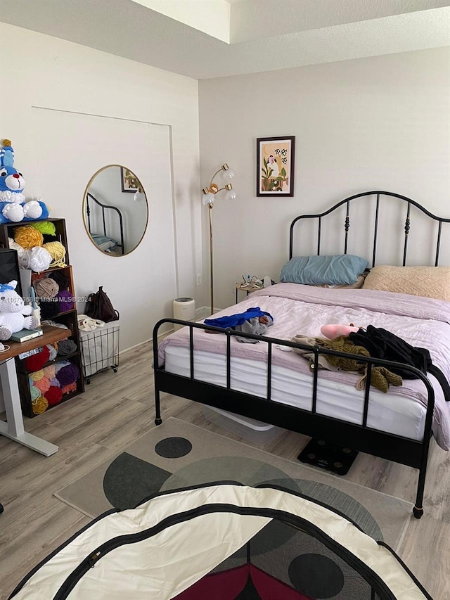 bedroom with light hardwood / wood-style flooring