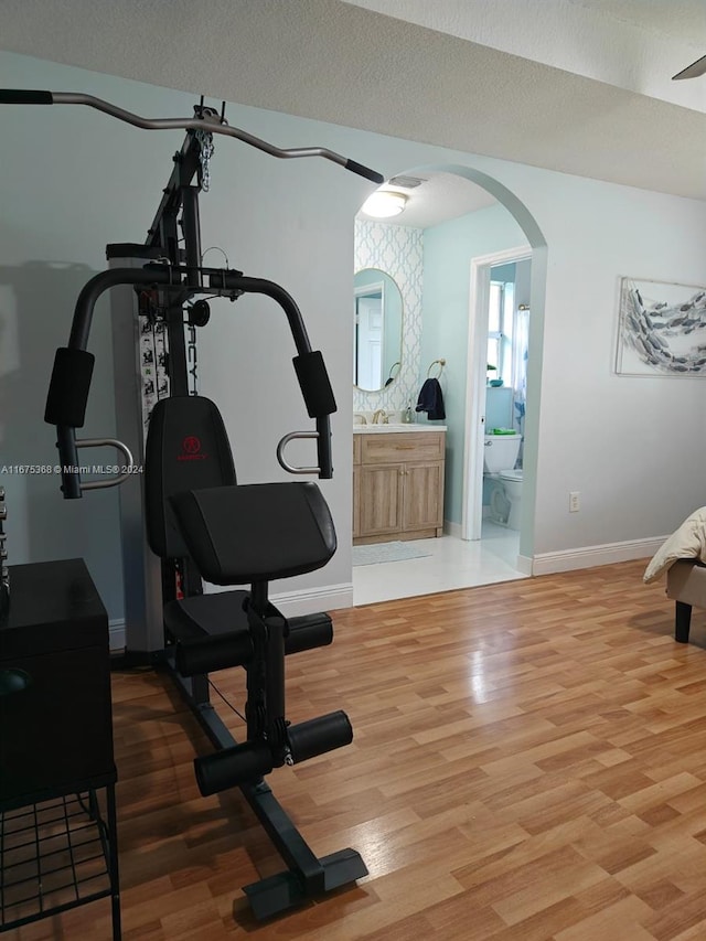 workout area featuring wood-type flooring