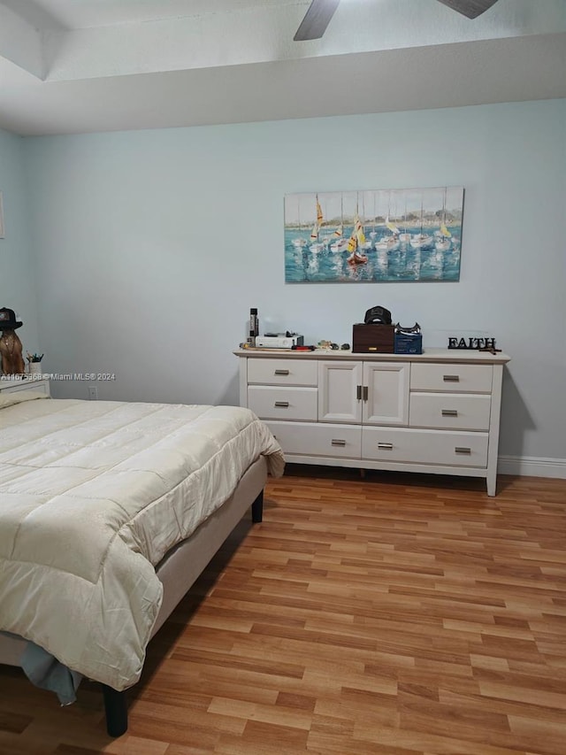 bedroom featuring light wood-type flooring and ceiling fan